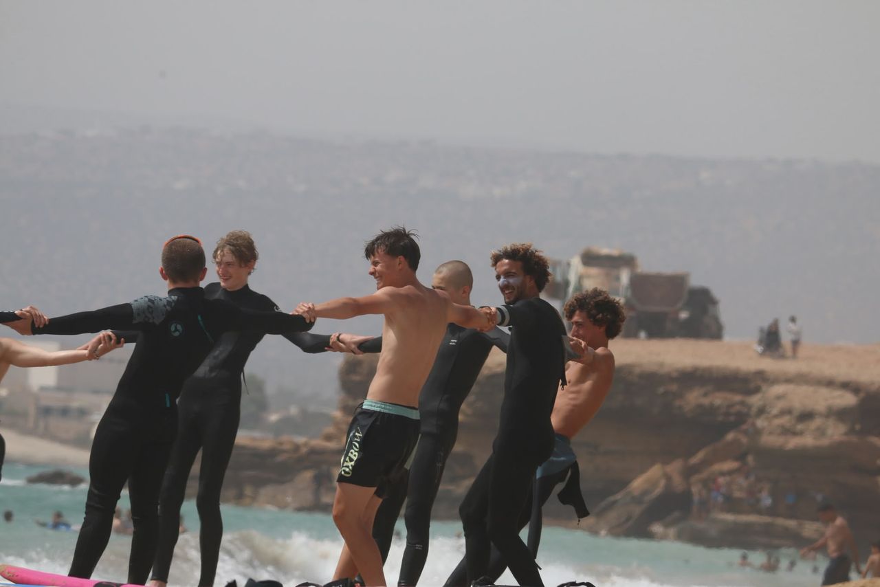 Group warm-up on the beach